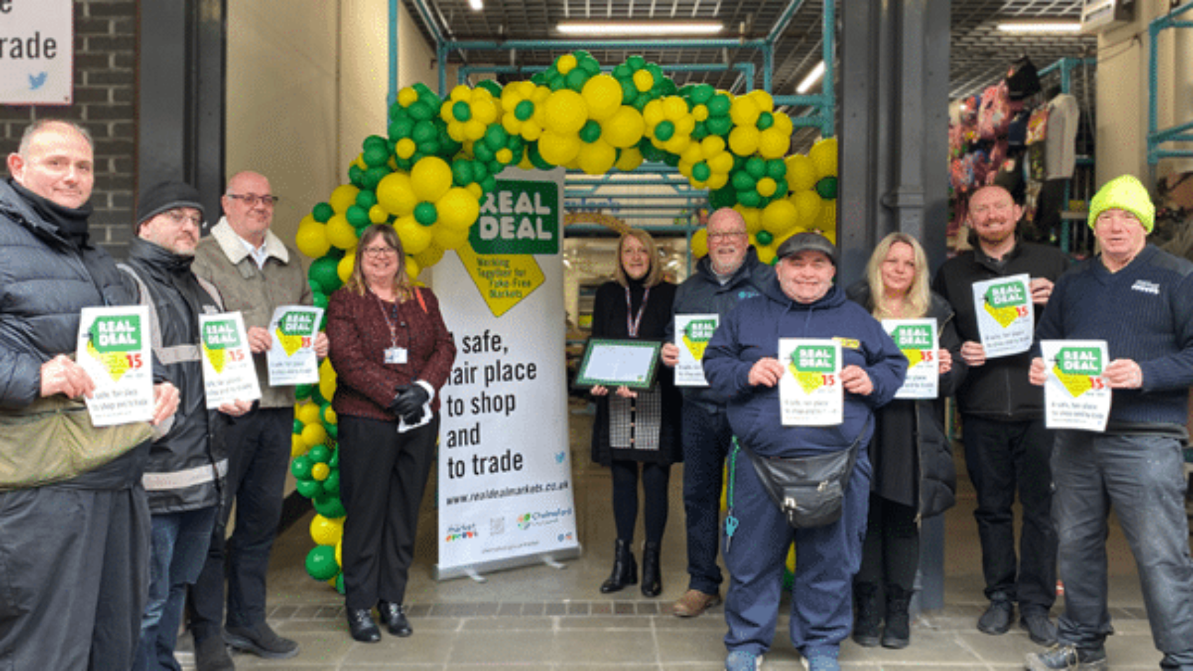 Cllr Donna Eley (centre left) and Pauline Rider (centre right) joined with other members of the markets team, City Council staff and Chelmsford Market traders for a colourful celebration of the market’s Real Deal accreditation in February this year